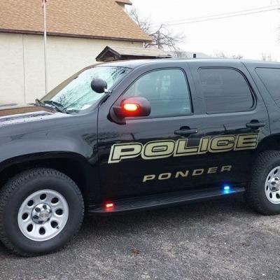 The drivers side of a Ponder Texas police car